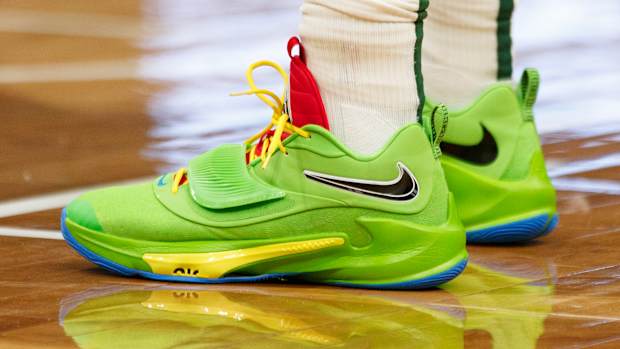 View of green Nike Zoom Freak shoes.